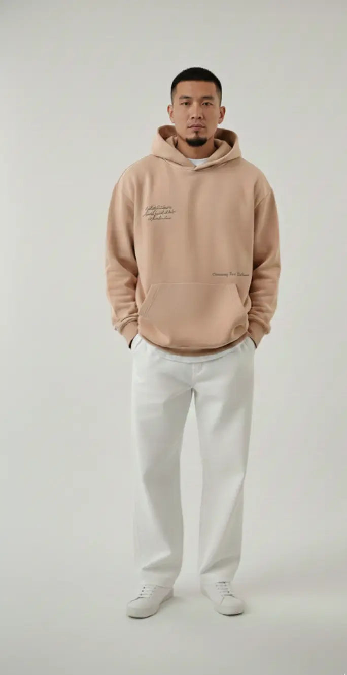 Male model wearing The Dune Hoodie in beige - oversized streetwear for men in Pakistan
