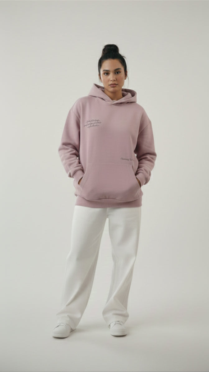A young  woman wearing the Lalic lavender unisex hoodie from the front, showcasing the cozy fit and soft fabric for both genders.

