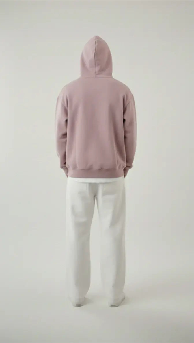 Back view of a man modeling the Lalic lavender hoodie, showing the relaxed fit and clean design of the unisex pullover.

