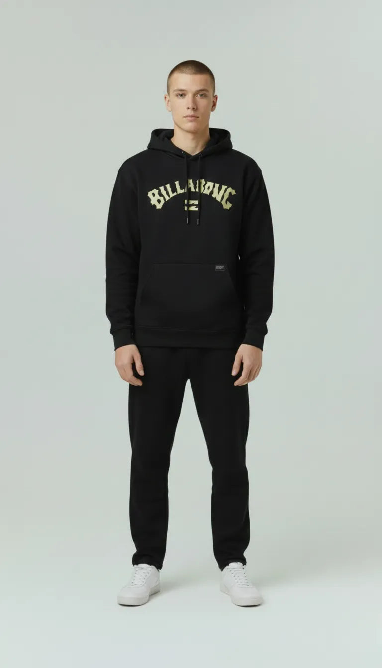 A male wearing a black hoodie with 'Billabong' logo on a white background