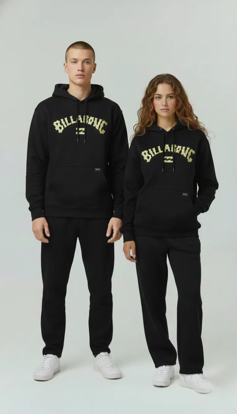 Unisex  wearing black Billabong hoodies and pants on a white background